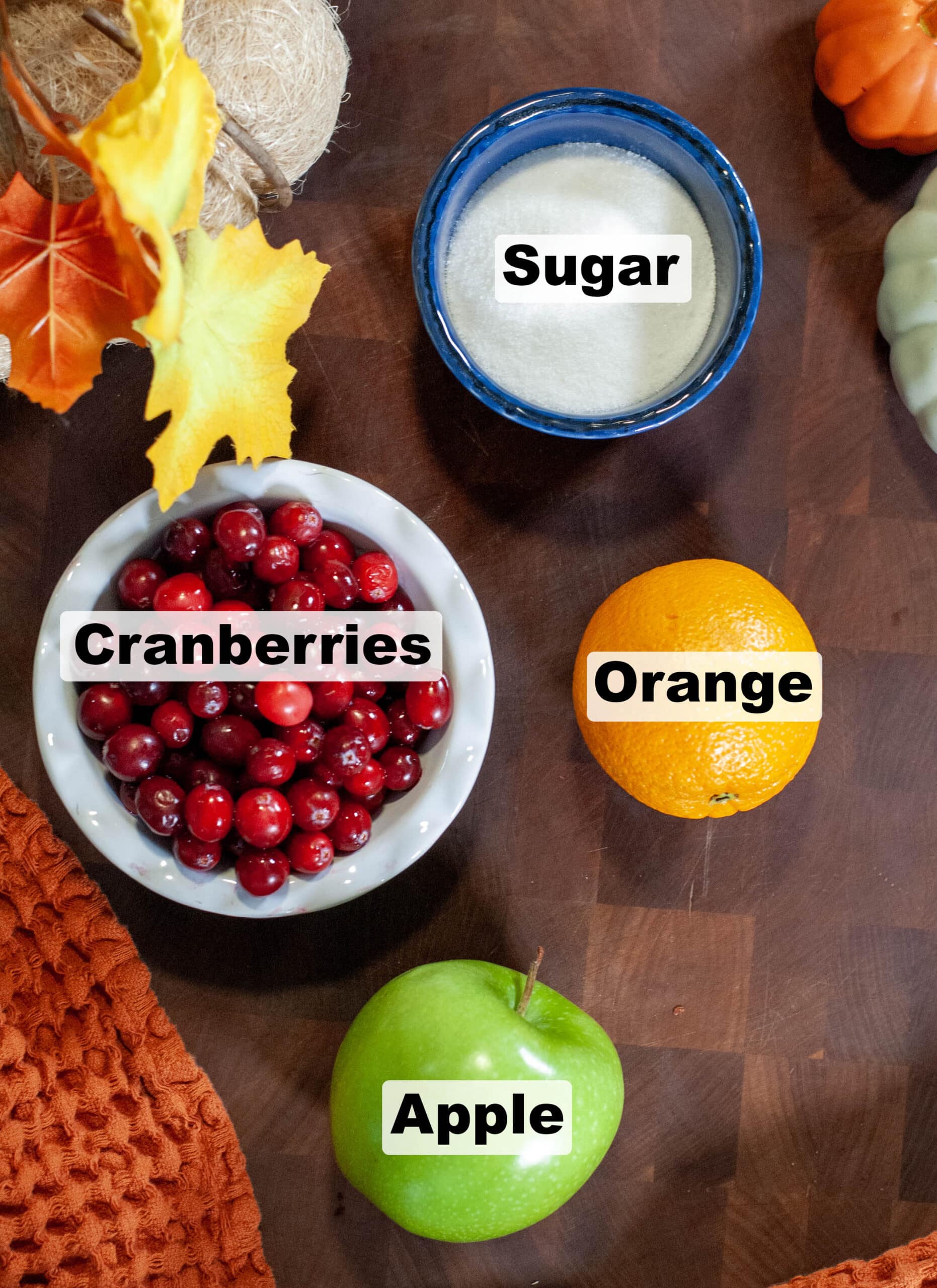 Cranberry relish ingredients on a cutting board.