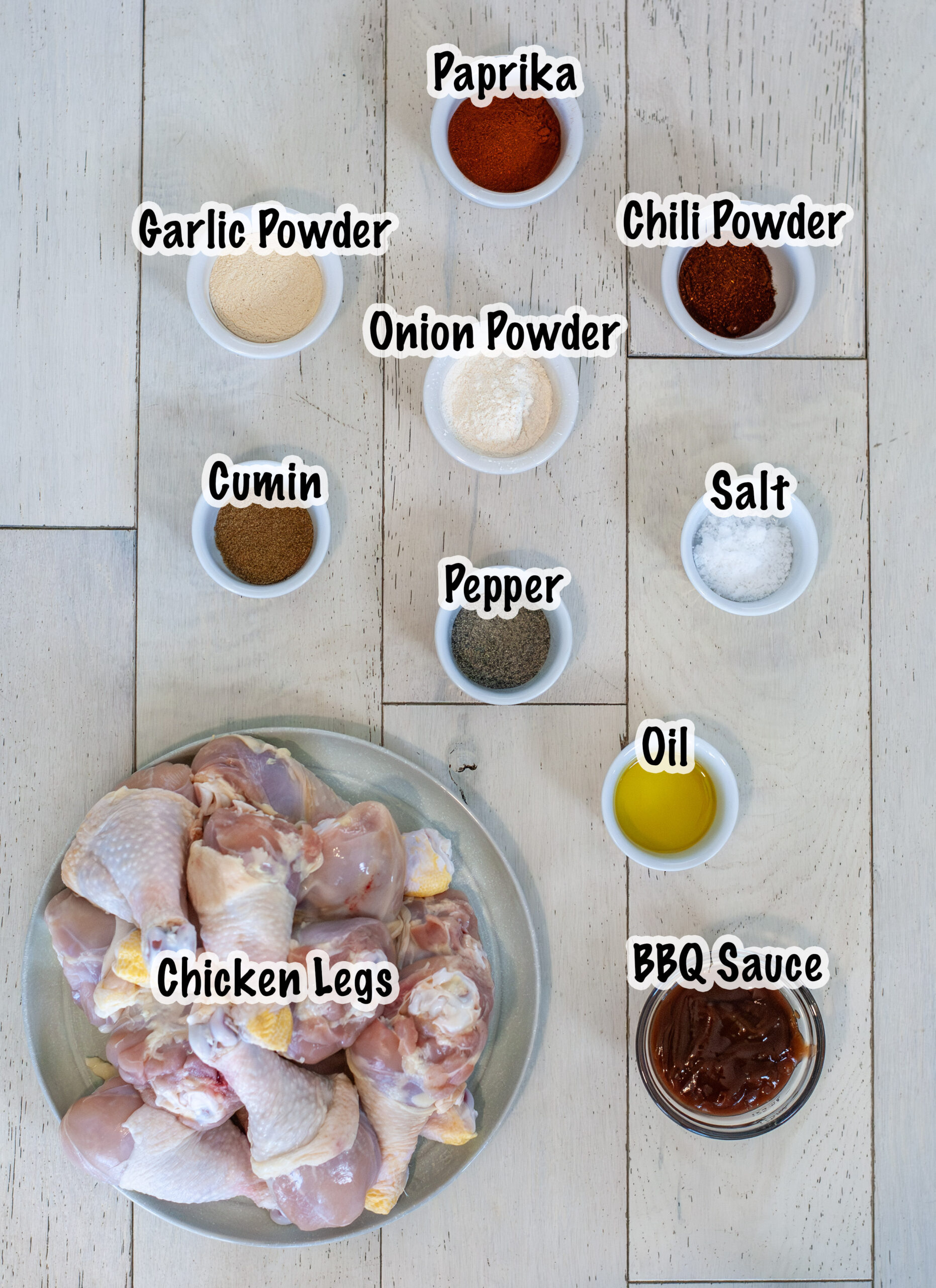 Ingredients measured out for baked chicken legs recipes.