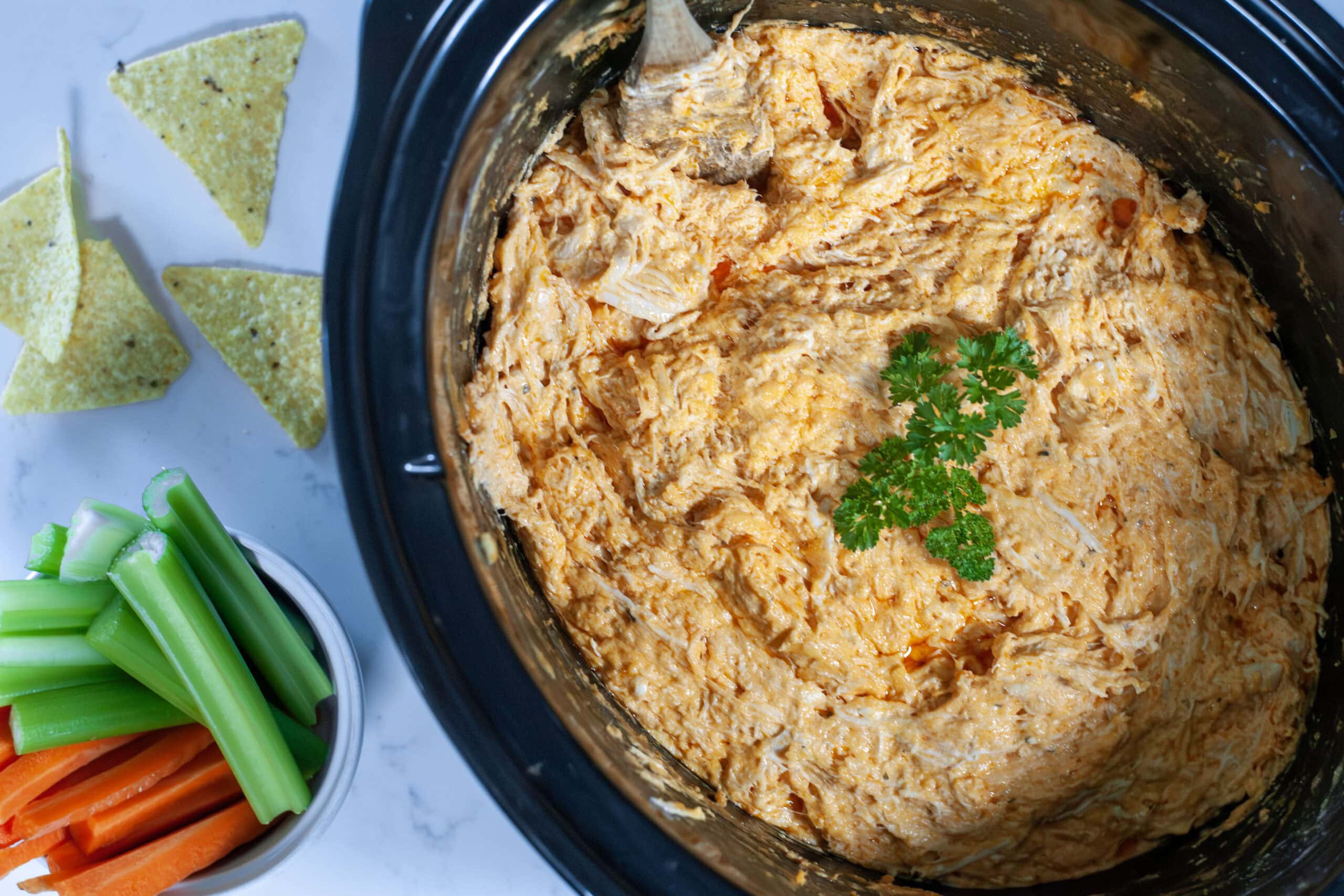 Buffalo Chicken dip in a slow cooker.
