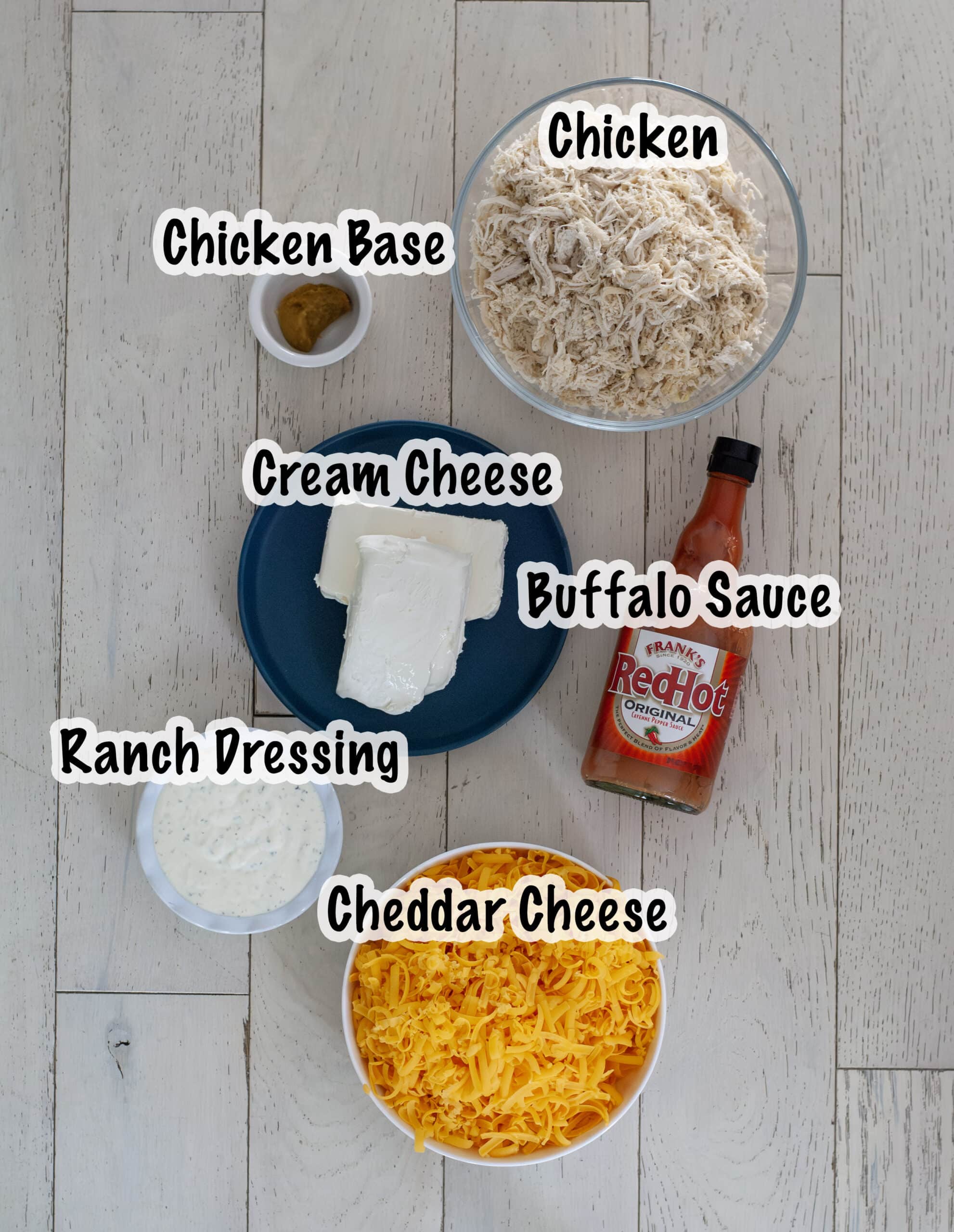 Measured out ingredients for slow cooker buffalo chicken dip.