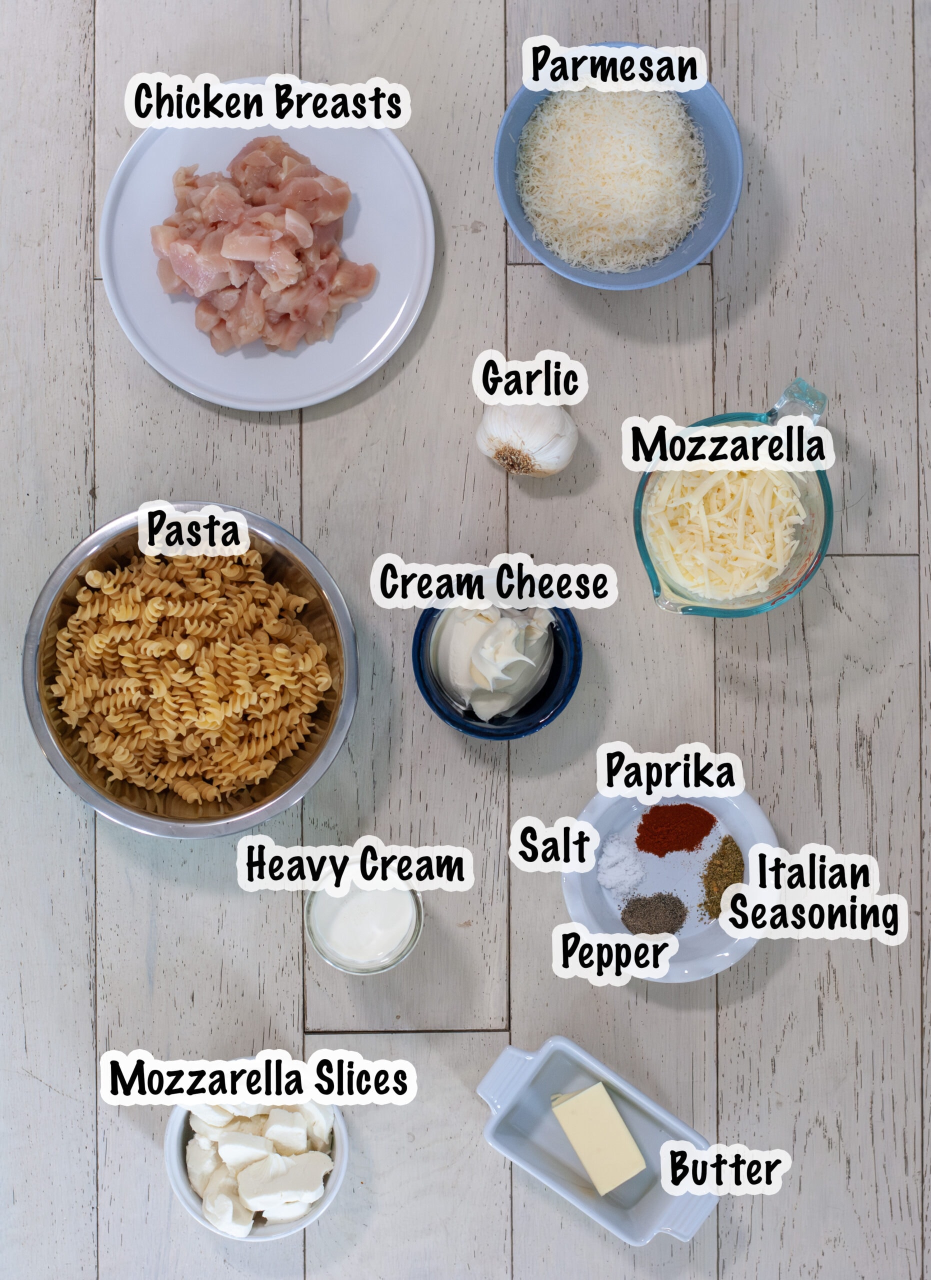 Ingredients measured out for cooking a chicken Alfredo bake recipe.
