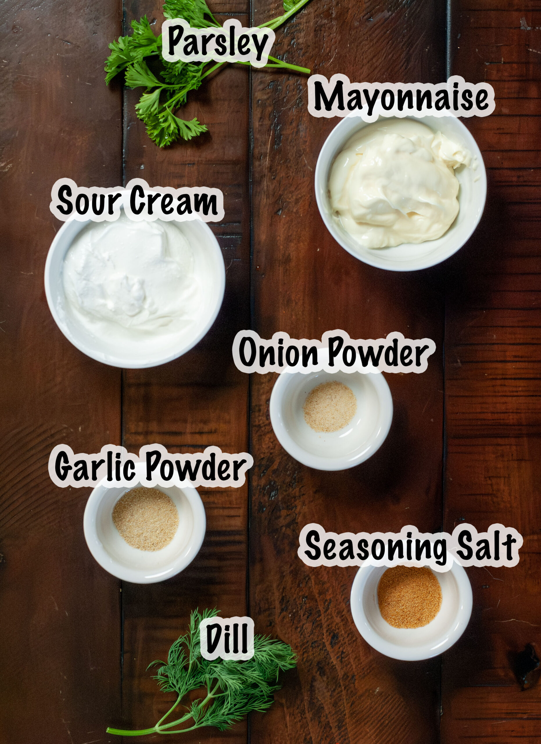 Ingredients for a dip measured out in bowls.