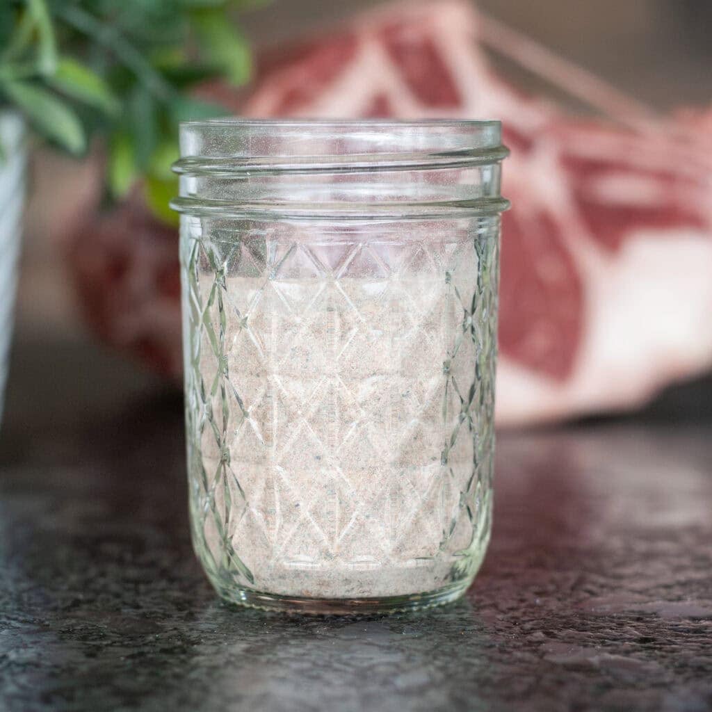 Prime Rib Seasoning in a glass bowl next to prime rib.