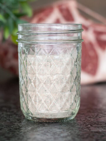 Prime Rib Seasoning in a glass bowl next to prime rib.