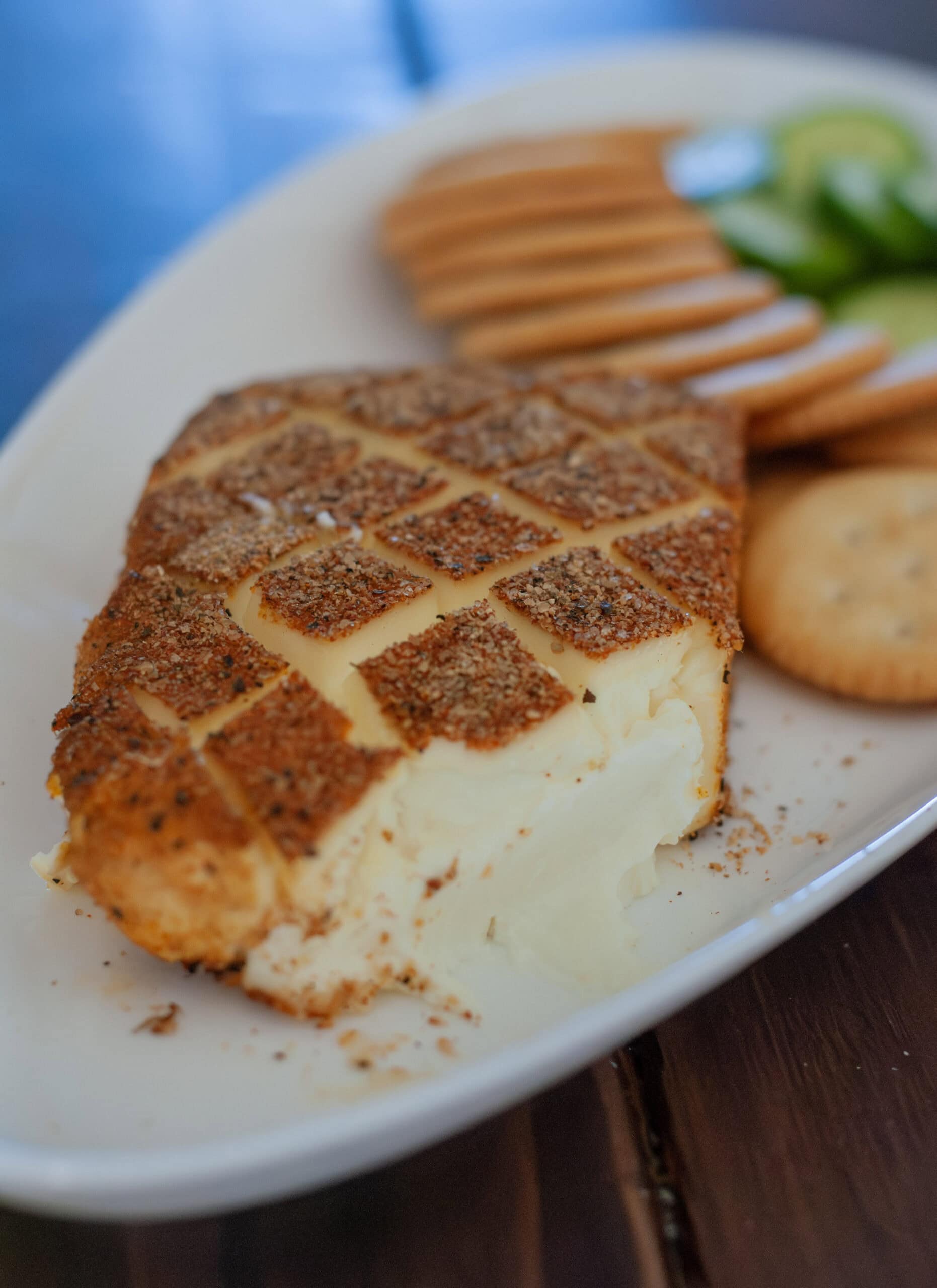 Smoked cream cheese with BBQ seasoning on top.