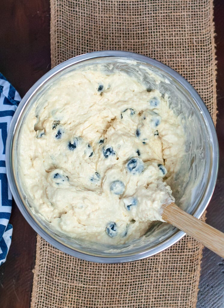 Blueberry waffle mixture in a mixing bowl.