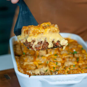 A scoop of cheeseburger tater tot casserole.