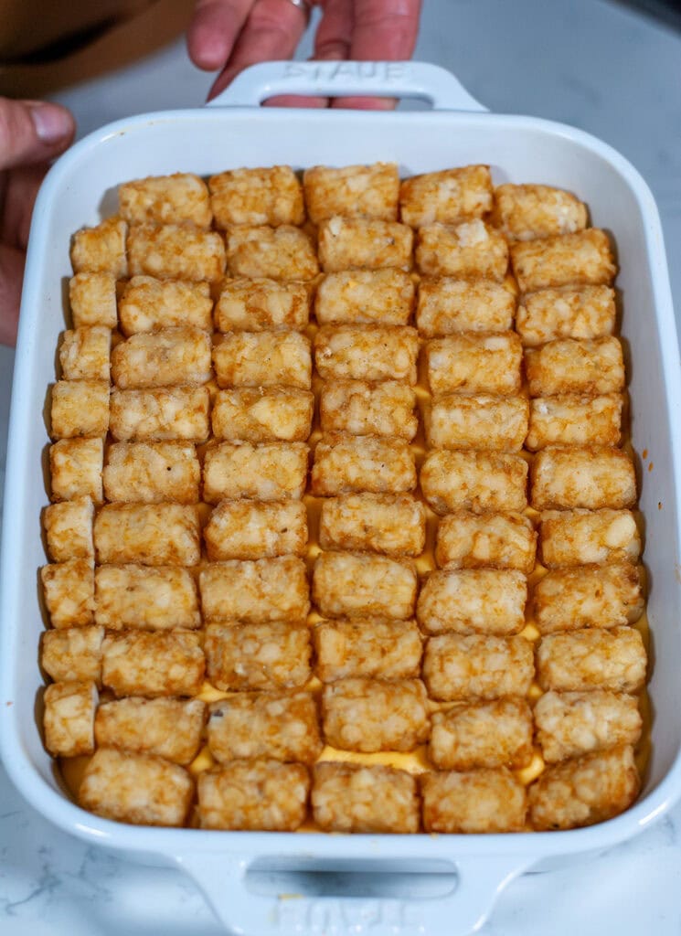 Cheeseburger tater tot casserole ready for the oven.