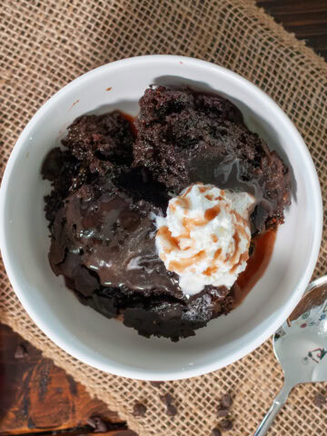 Crock pot lava cake with syrup and whipped cream.