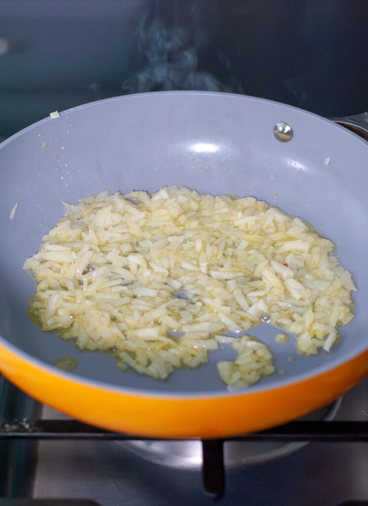 Sautéed onions in a skillet.