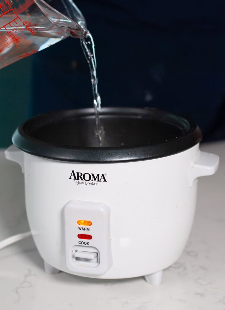 Water going into a rice cooker.