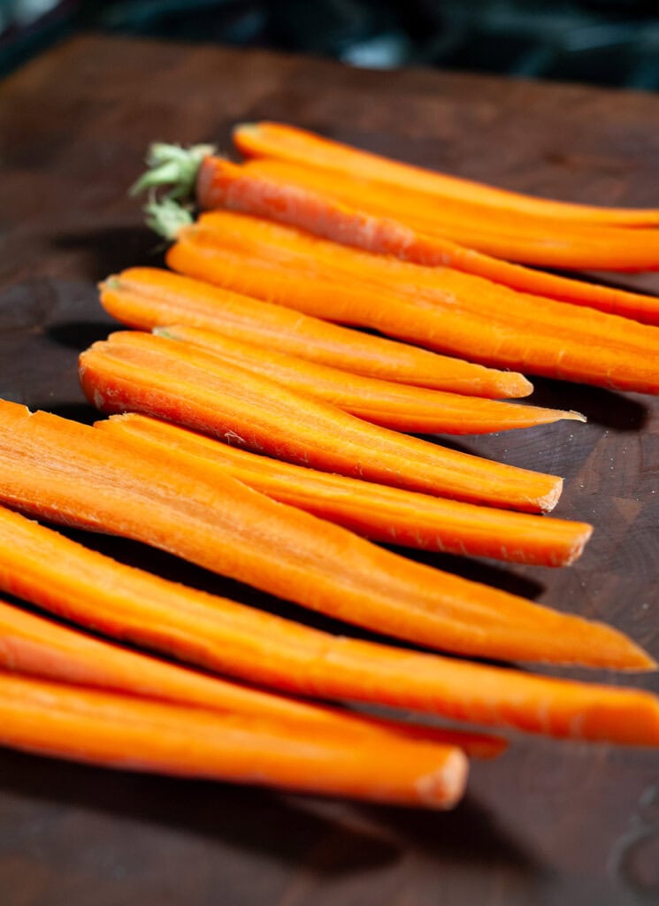 Carrots sliced in half long ways.