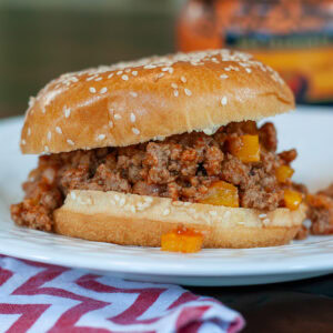 Sloppy Joe made with ground turkey on a bun with pickles.