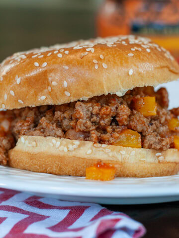 Sloppy Joe made with ground turkey on a bun with pickles.