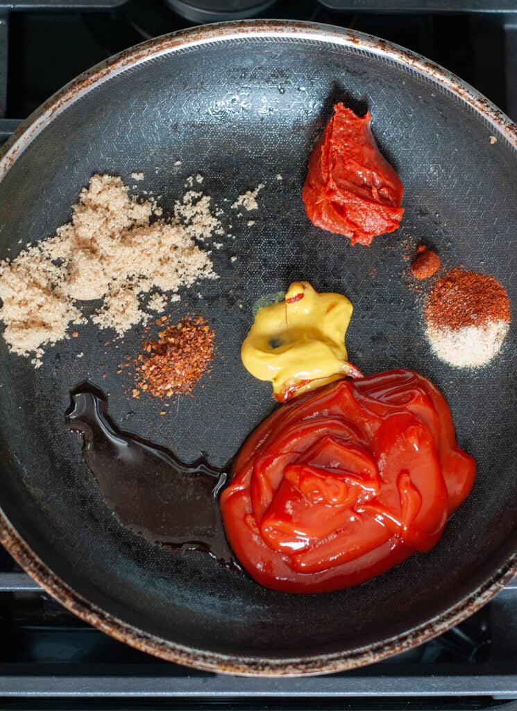 Ingredients in a skillet for sloppy Joe sauce.