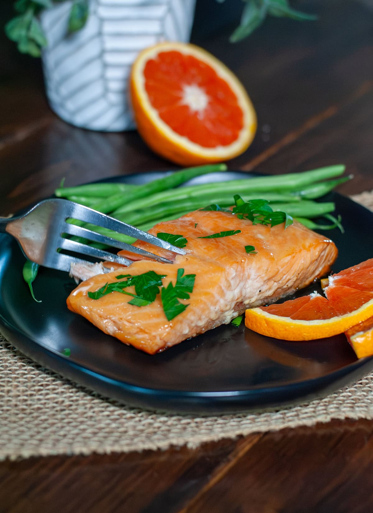 A fork full of pellet grilled salmon.