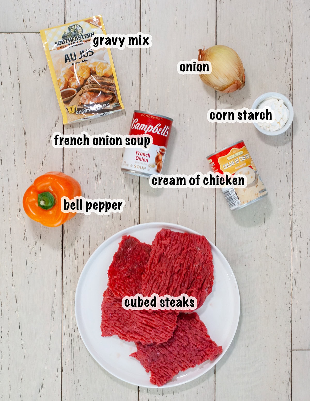 Slow cooker cube steak ingredients measured out on counter.