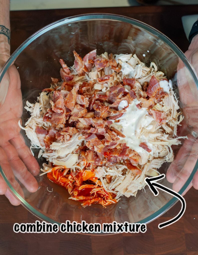 A bowl of chicken, bacon and ranch ready to be mixed. 