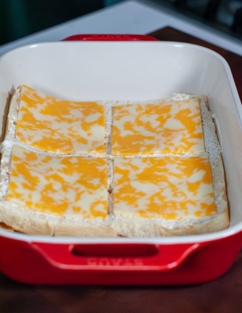 Cheese layered over ranch on a Hawaiian bun.