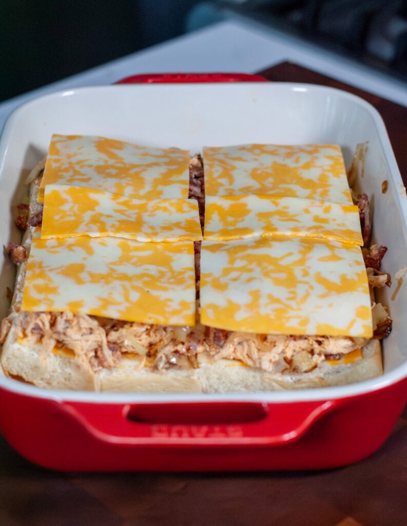 A layer of cheese on bacon chicken mixture.
