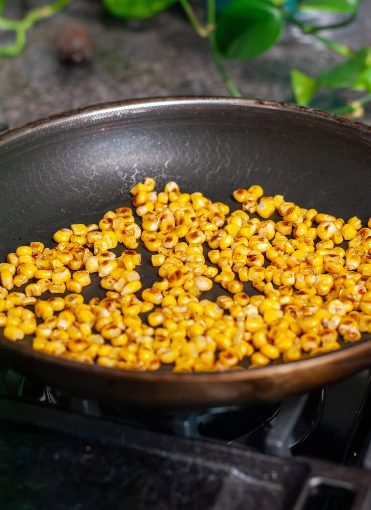 Roasted corn in a skillet.