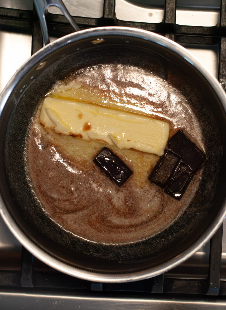 Butter and chocolate melting in a sauce pan.