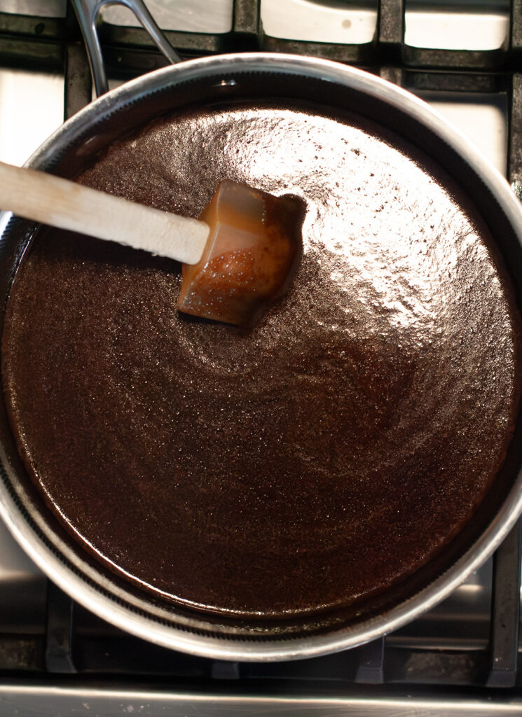 Melted chocolate sauce in a sauce pan.