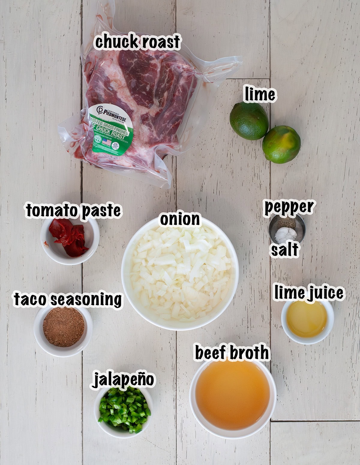 Labeled ingredients for slow cooker beef tacos.
