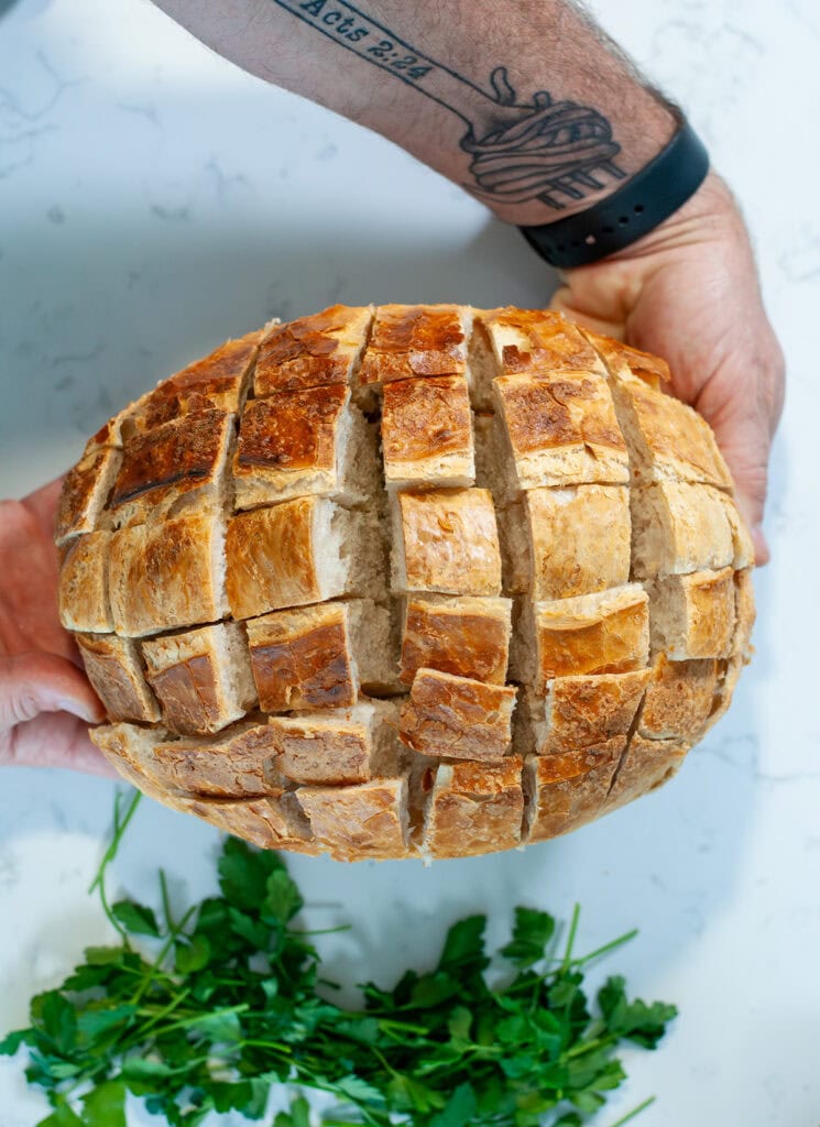 A load of sourdough cut into squares midway through the loaf.