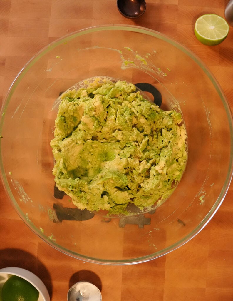 A bowl of mashed avocado.