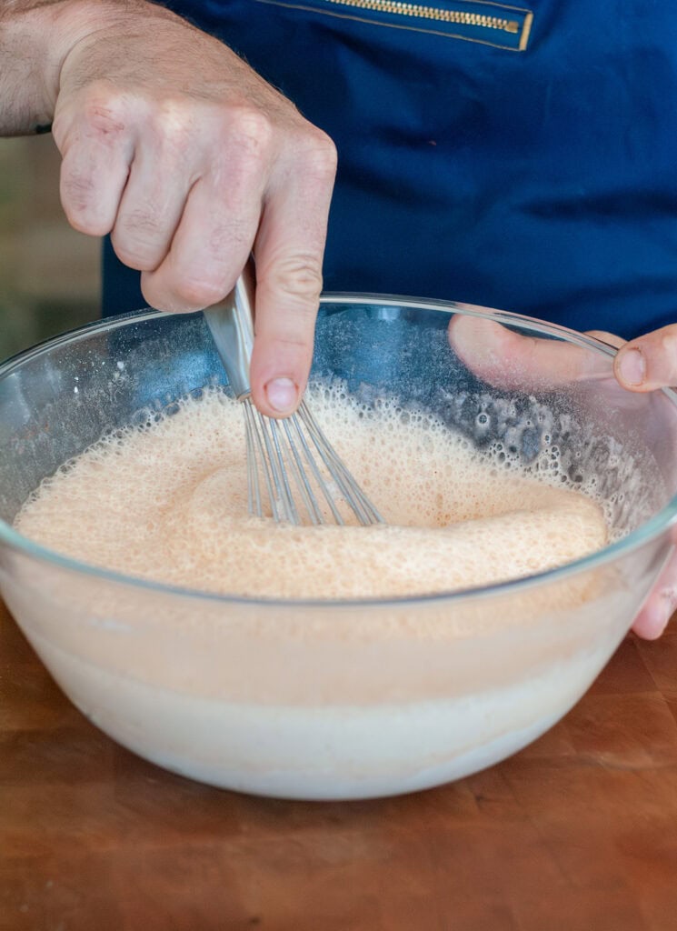 Whisked beer batter in a bowl.