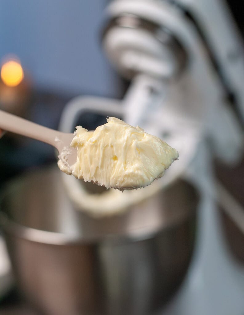 A spatula showing the creamy butter mixture. 