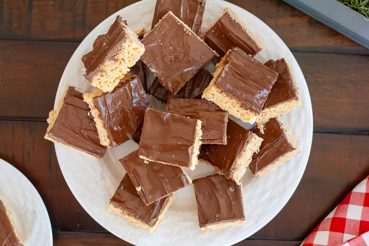 A top view of a stack of chocolate peanut butter and rice crispy treats. 