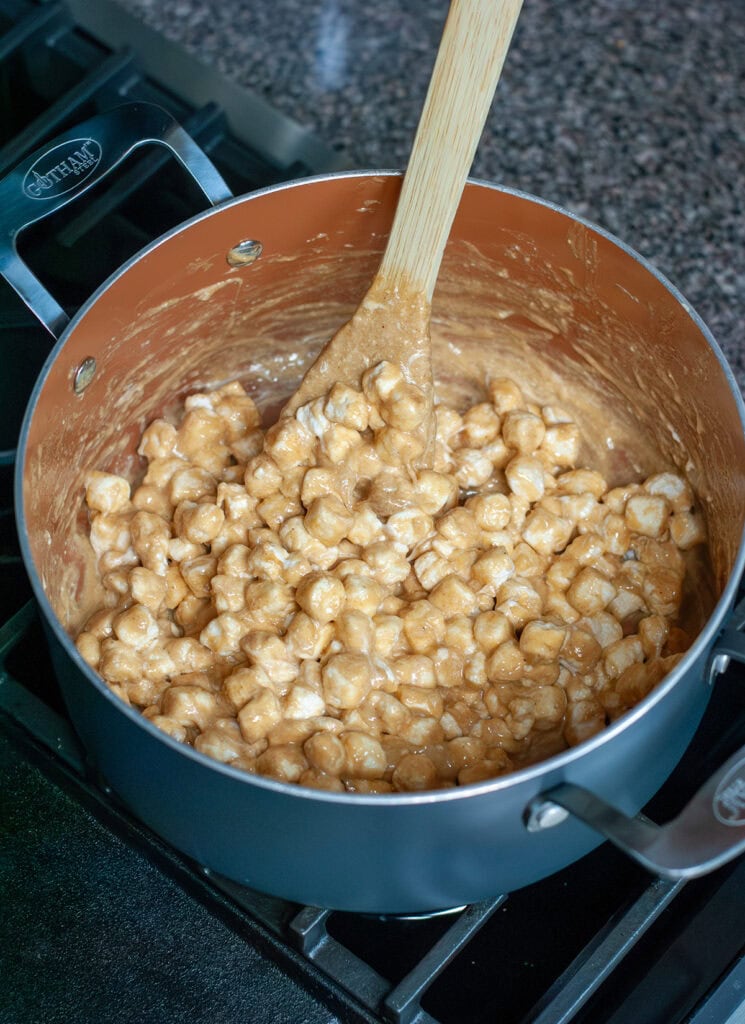 A pot showing marshmallows being melted with butter and peanut butter. 