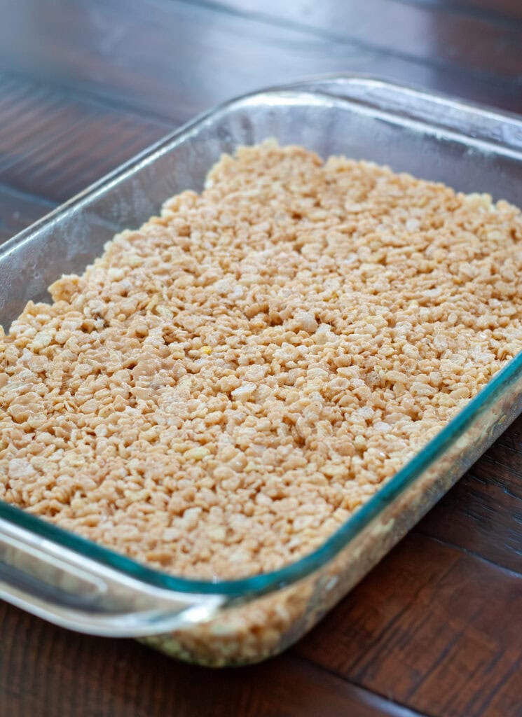 A view of the peanut butter treats without the chocolate in a 9x13 dish. 