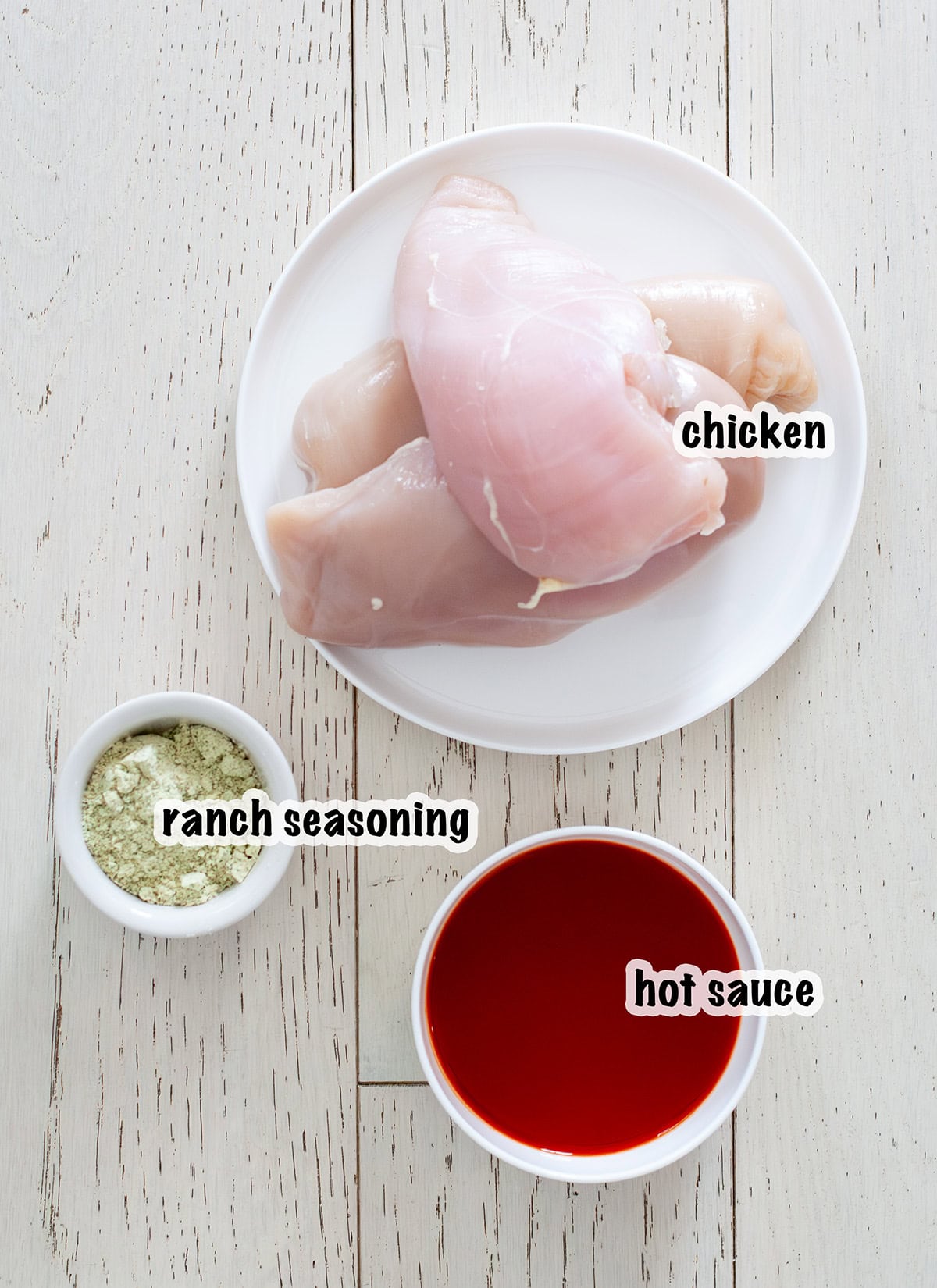 3 ingredient crock pot buffalo chicken ingredients laid out. 