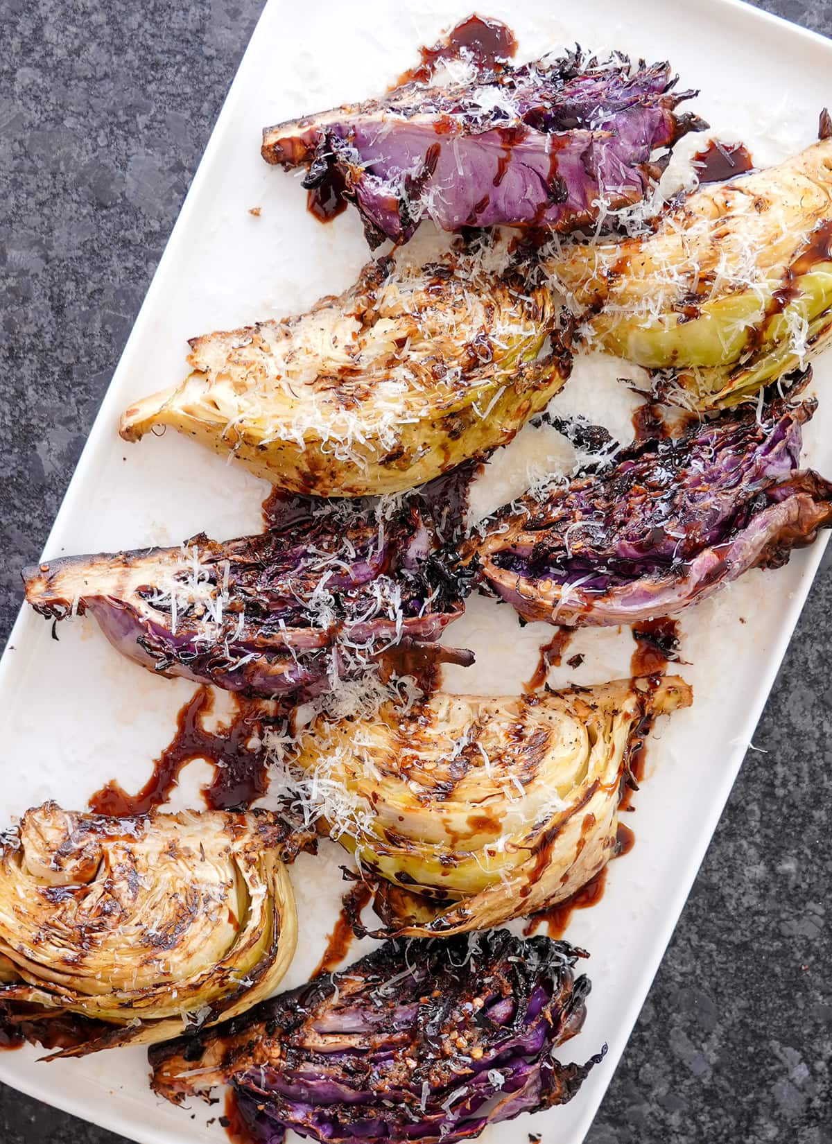 A top photo of Grilled cabbage steak recipes showing parmesan and balsamic glaze. 