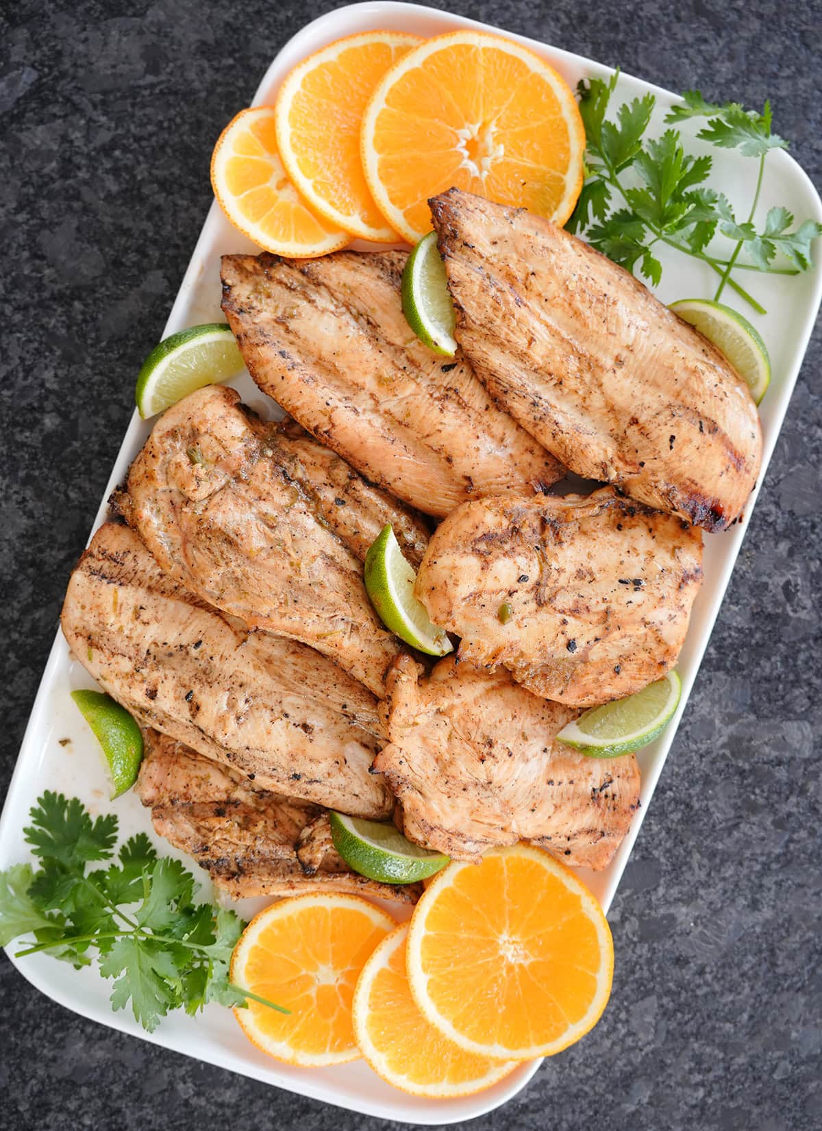 Grilled chicken with limes, oranges and cilantro.