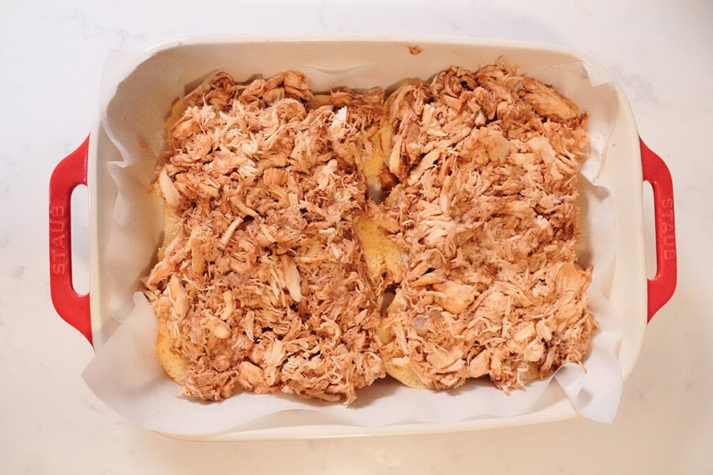 Chicken and BBQ sauce layered on the bread.