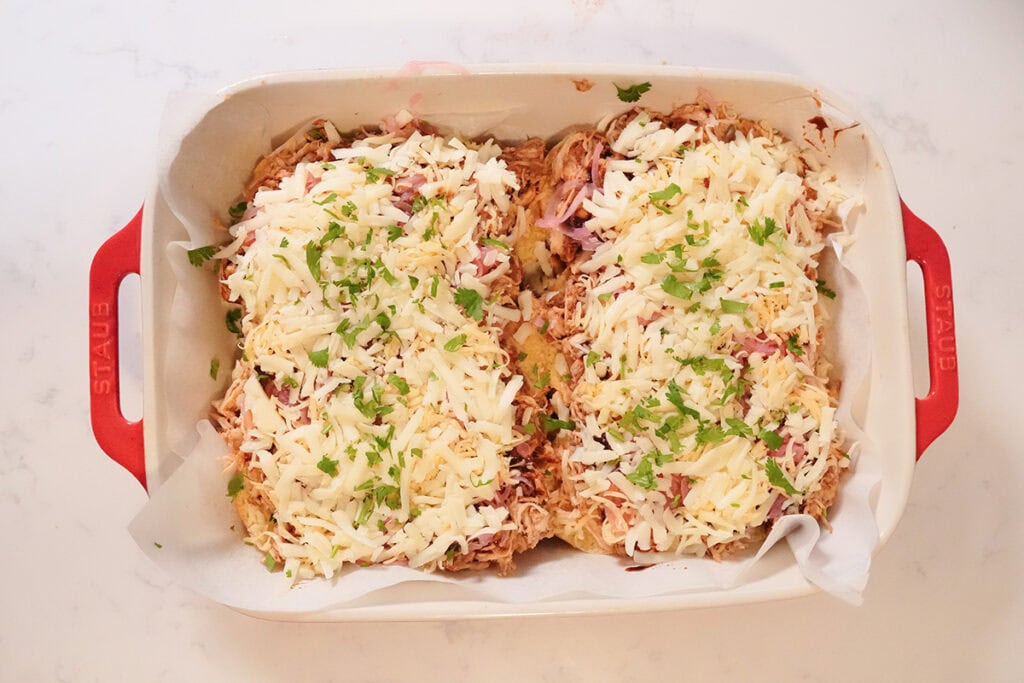 Cheese, diced cilanto layer on bottom of sliders.