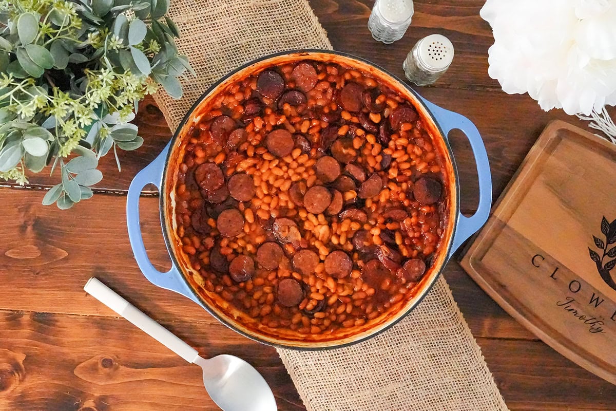 baked beans and sliced smoke sausage in a skillet.