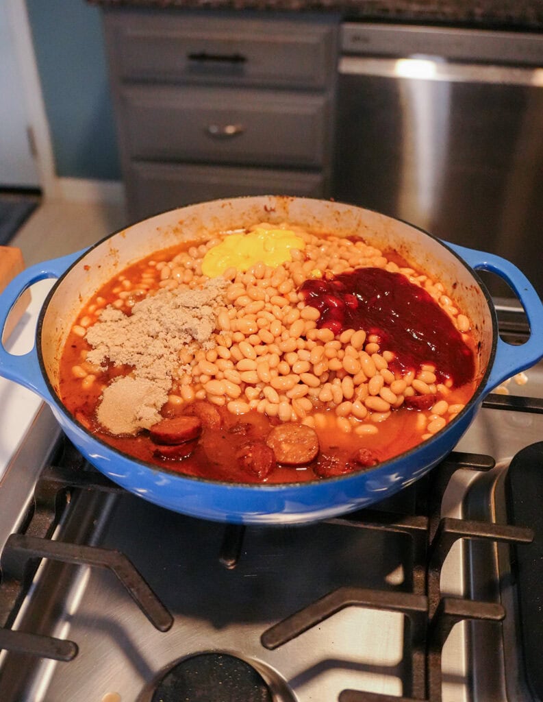 brown sugar, sausage, beans and seasonings in a skillet.