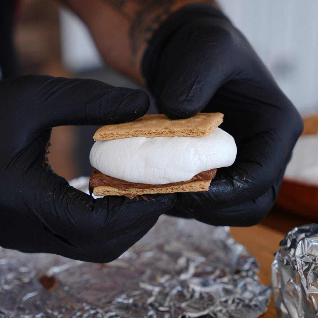 A s'more with gooey marshmallows and melted chocolate.