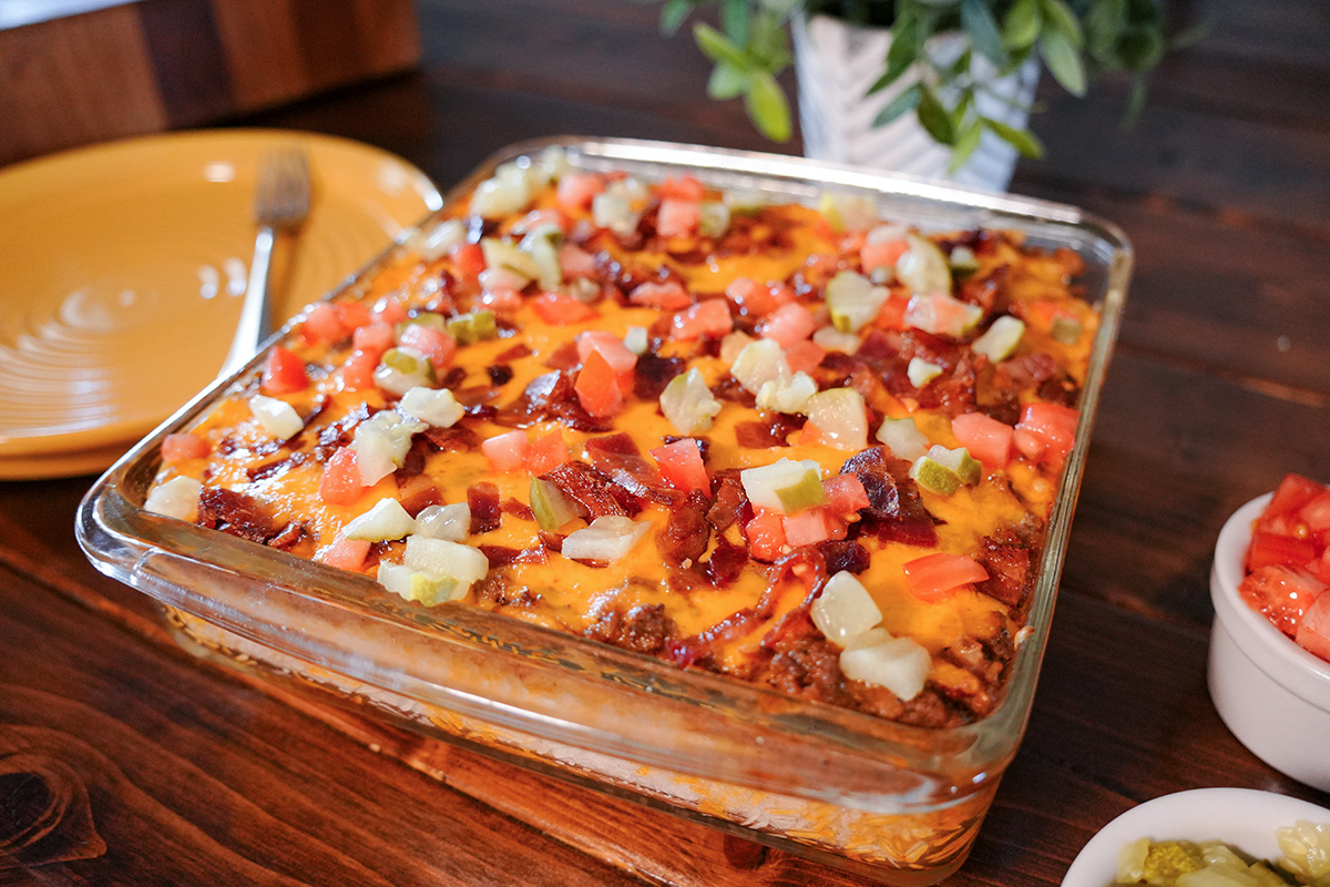 bacon cheeseburger casserole in a glass baking dish.