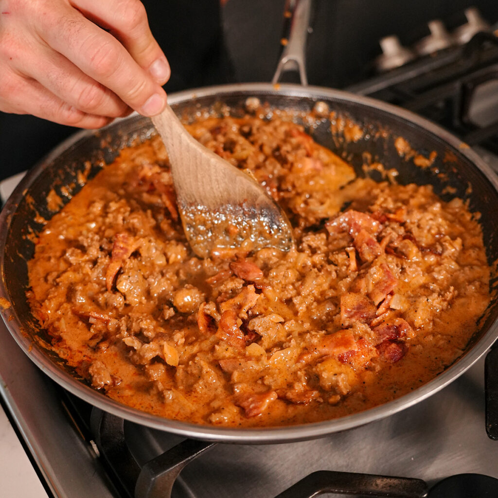 mixture of ground beef, bacon and sauce for the casserole.