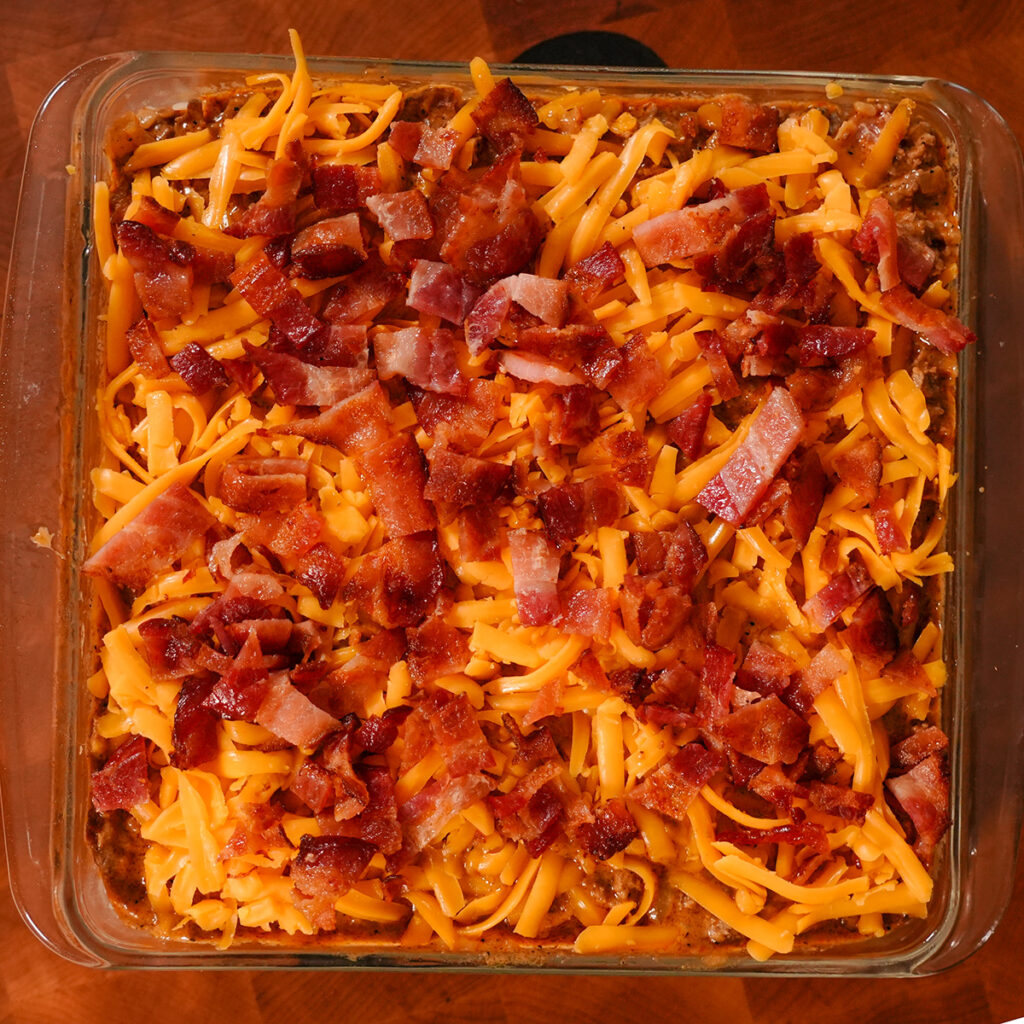 bacon and cheese layered on top of rice.