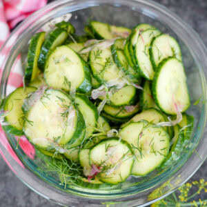 cucumber dill salad in a glass bowl.