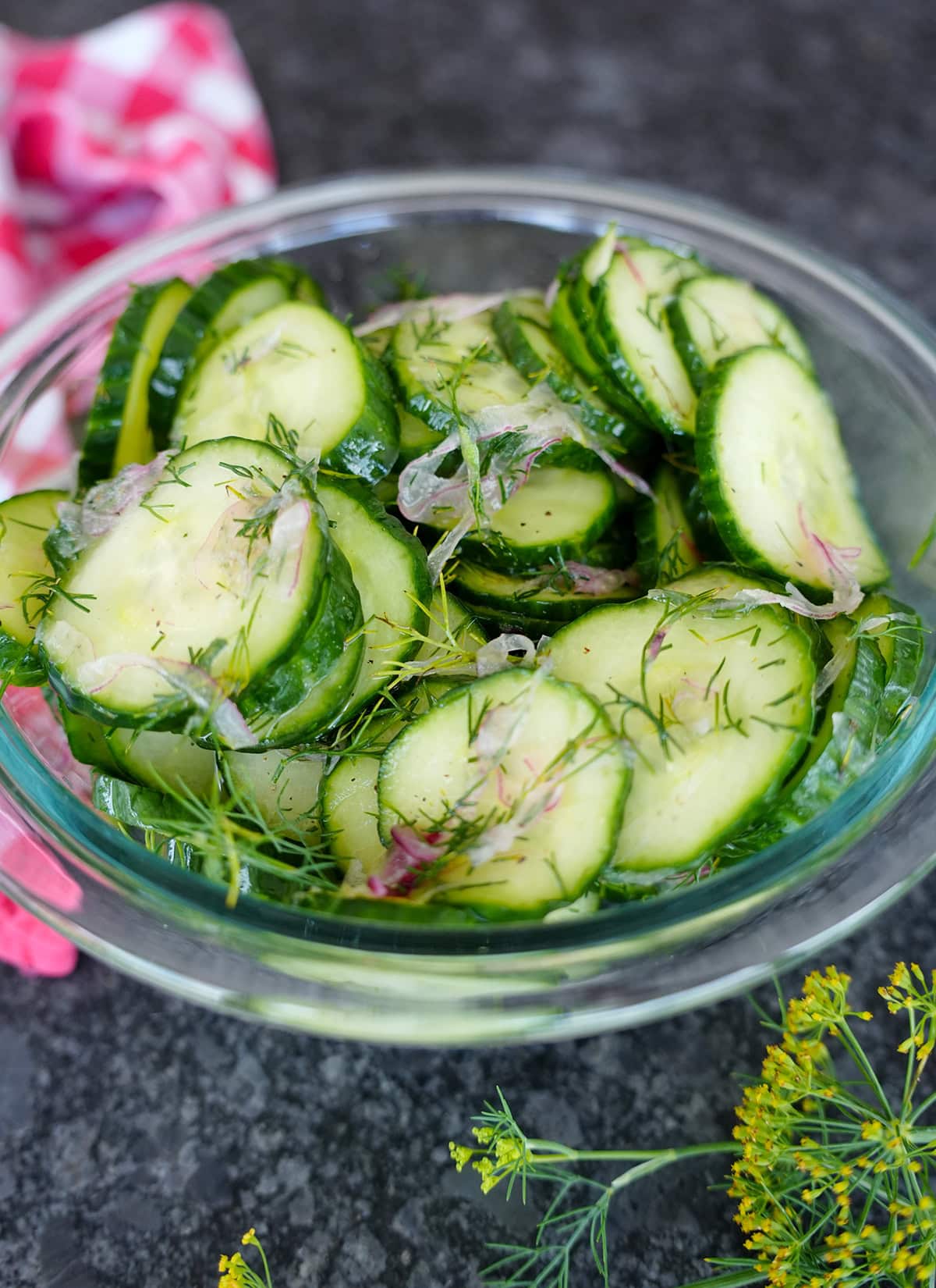 Cucumber Dill Salad in a bowl with red onions.