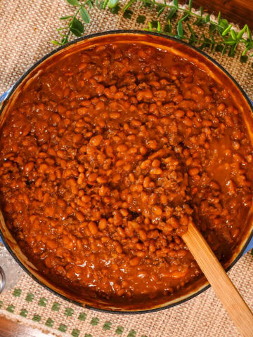 baked beans with ground beef in a skillet.