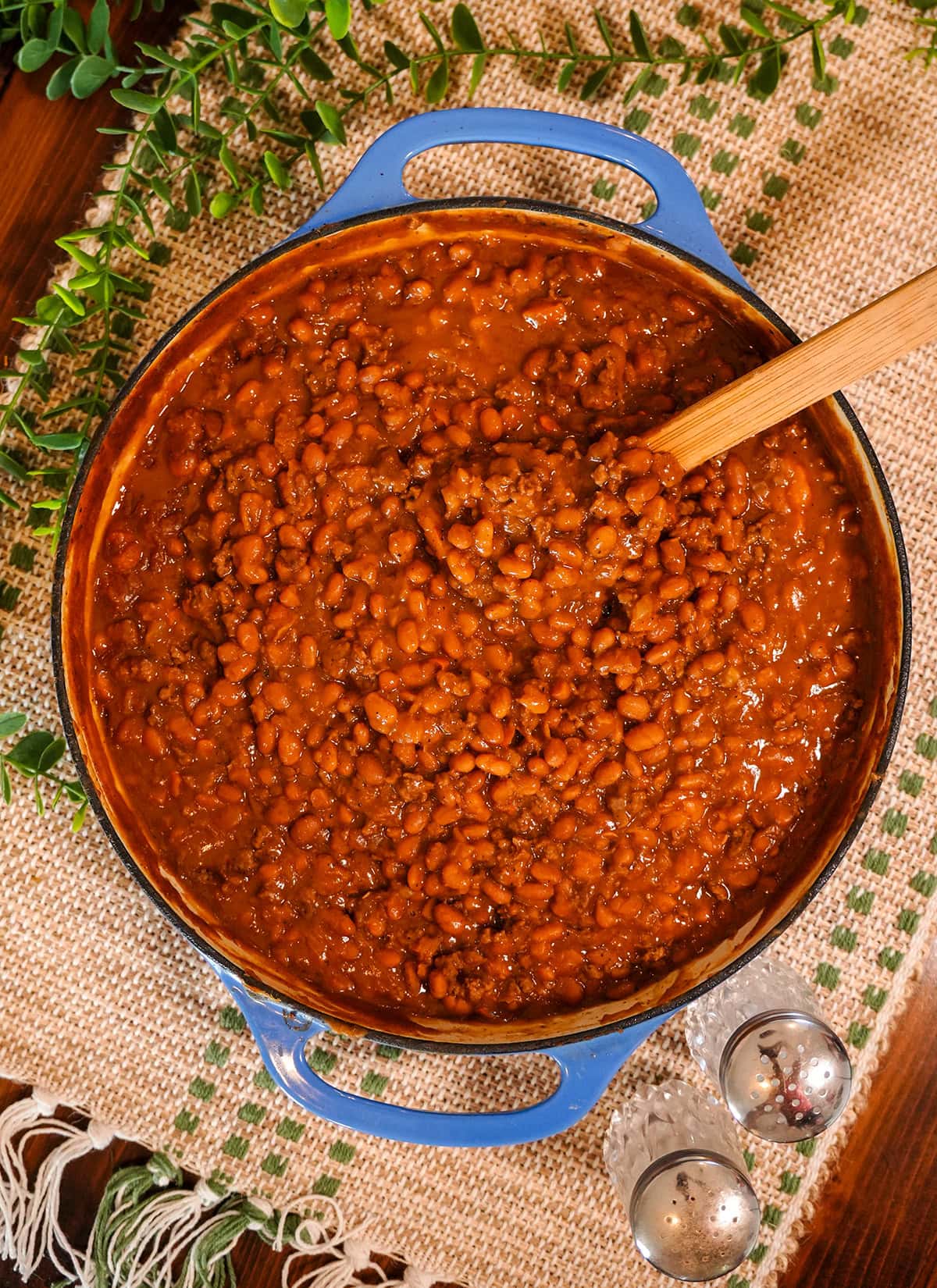 baked beans with hamburger meat in a dutch oven.